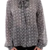 Blusa con fiocco e manica a sbuffo fantasia