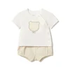 Completo t-shirt e shorts panna