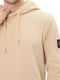 Felpa con cappuccio e badge sulla manica kaki