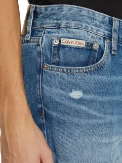 Jeans cropped con strappi denim medio
