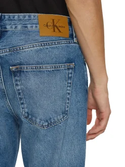 Jeans cropped con strappi denim medio