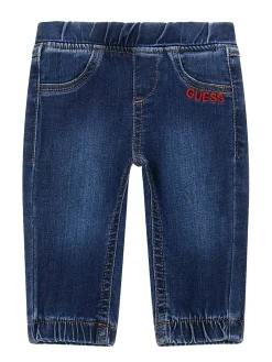 Jeans pull on con orsetto sul retro denim scuro