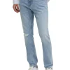 Jeans slim con effetto strappi in denim chiaro