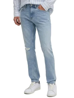 Jeans slim con effetto strappi in denim chiaro