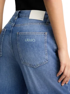 Jeans wide leg con piega stirata denim medio