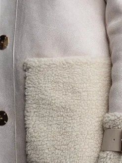Montone lungo dettagli teddy beige