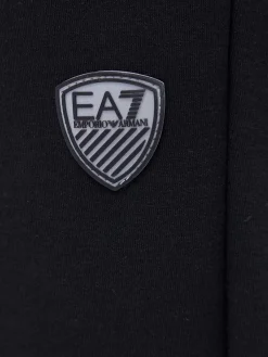 Tuta con zip e placca logo nero